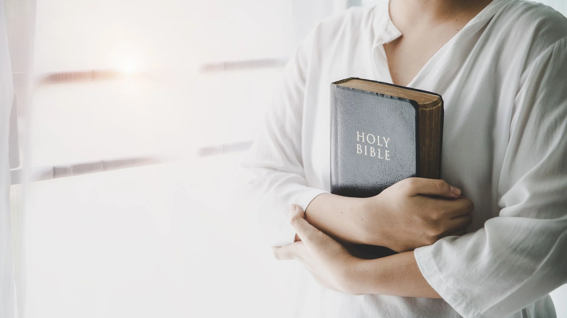 Woman holding a Bible