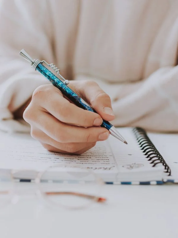 Woman writing in a notebook